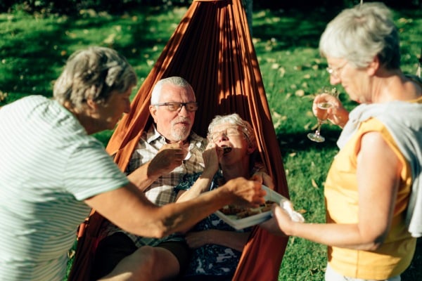Harrison of Wildwood | Seniors in a hammock